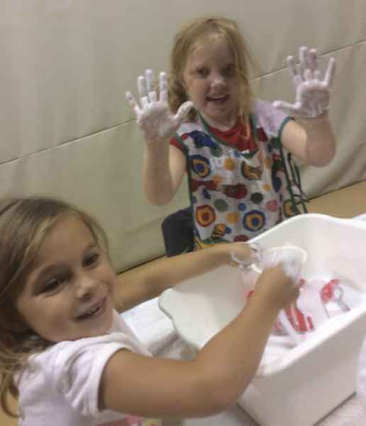 girls playing with slime